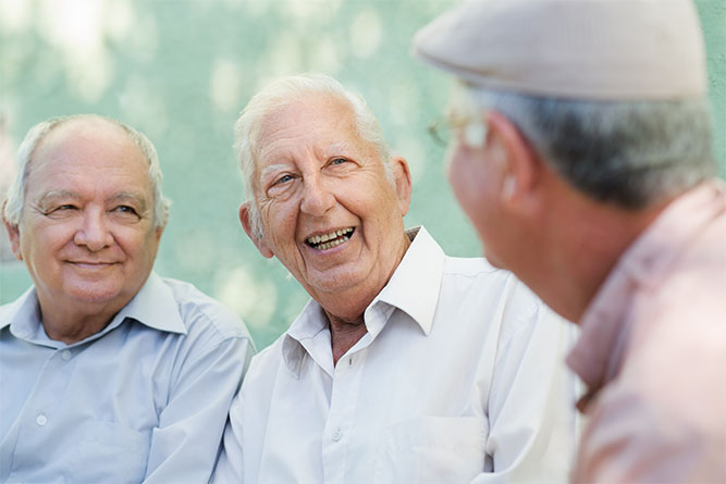 Prestige Wealth Partners - group of happy elderly men laughing and talking